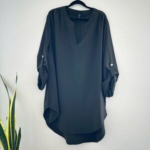 Curve hem notch neck tunic blouse with high low hem.